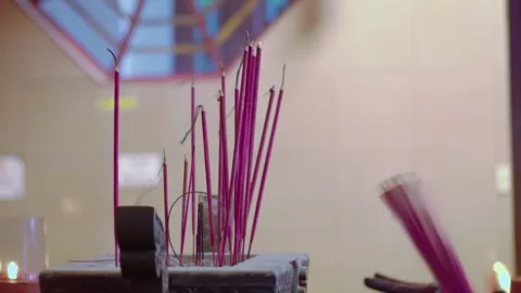 Close-up of hand put Burning Incense Sticks in a Buddhist Temple. unrecogni.. Stock Footage 326304880