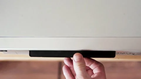 Close up of a hand puting a videotape into video player. Retro vhs cassetC1583 5 Stock Footage 305181755