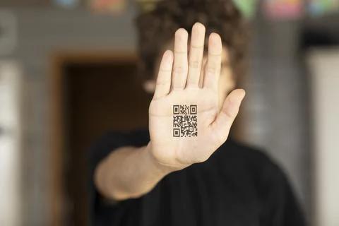 Close-up hand with QR code, covid 19 vaccination concept Stock Photos