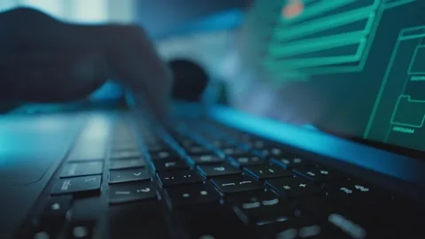 Close up on hand quickly typing on laptop keyboard as files upload to cloud Stock Footage 340234035