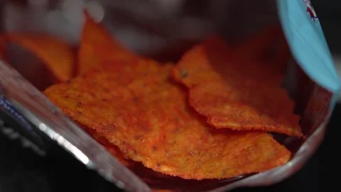 Close Up of Hand Reaching into Bag of Crunchy Corn Chips Stock Footage 332117653