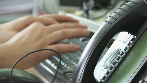Close-Up of Hand Reaching to Pick Up Phone Handset in Office Setting Stock Footage 296738382
