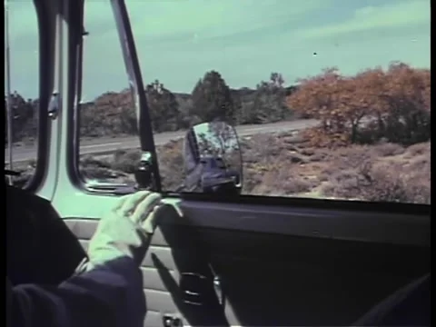 Close-up of hand rolling down car window Stock Footage 260248816