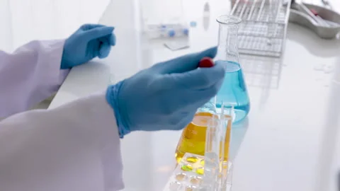 Close up hand of scientist or technician in laboratory test chemistry liqui.. Stock Footage 243417768