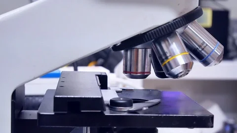 Close up hand scientist using light microscope in laboratory. Stock Footage 123403280