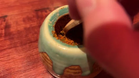 Close Up Hand Scooping Japanese Condiment from a Ceramic Jar with Wooden Spoon Stock Footage 333472265