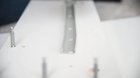 Close up hand screwing a screw to attach detail of furniture. Stock Footage 132591661