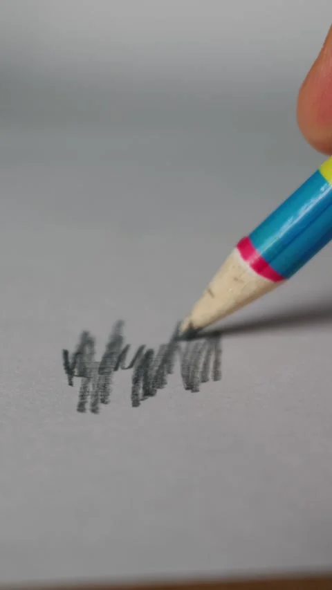 Close Up of Hand Scribbling with Colorful Graphite Pencil on White Paper Stock Footage 339365977