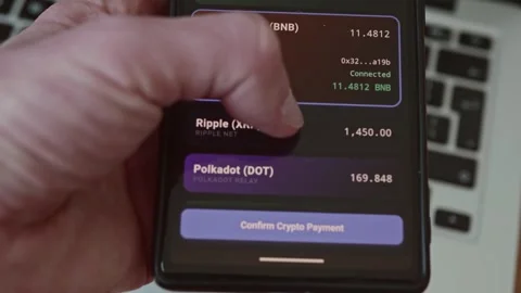 Close up of hand scrolling through crypto wallet application Stock Footage 337998106