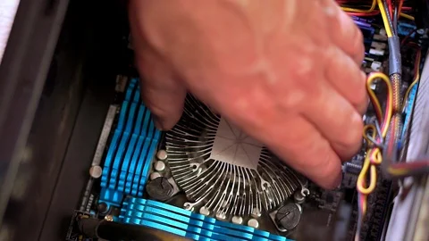 Close-up of the hand of the service man uninstall the radiator of the CPU. Stock-Footage 105397465