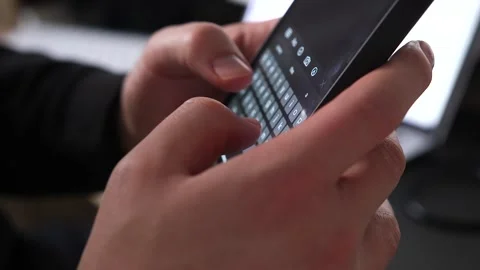 Close Up Hand Shot of Young Man Typing Notes on Smartphone Stock Footage 148210913