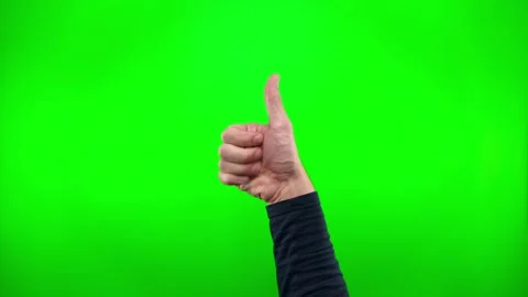 Close up of hand showing class with thumbs up on green screen background. Human Stock Footage 329827827