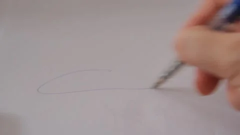 A close-up of a hand signing a document with a ballpoint pen, capturing the Stock Footage 301683891