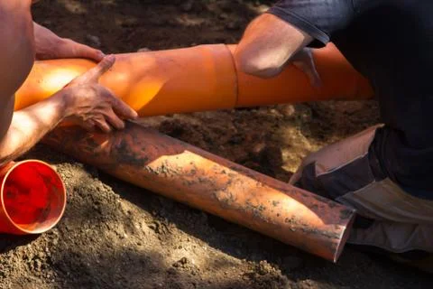 Close of hand of site workers without individual protections working with th Stock Photos