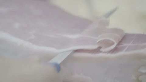 Close up of hand sliced prosciutto Stock Footage 218599204