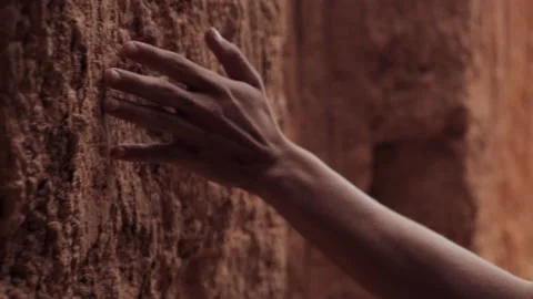 Close up of a hand sliding along the stone walls. Man's hand sliding Stock Footage 144095022
