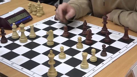 Close-up of a hand sliding a checkers piece across the board. Stock-Footage 332807602