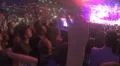 Close-up of hand with smartphone filming rock concert at stadium full of people 4k or 4k+ Resolution