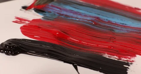 Close up of hand smearing wet paint on white paper Stock Footage 126126586
