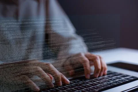 Close-up of hand of software developer writing code on laptop. Foto stock