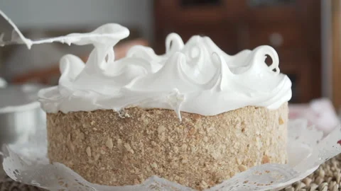 Close up in hand with spatula making the last details in the meringue Stock Footage 240770385