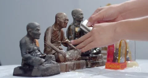 Close up hand sprinkle water onto a Buddha Statue in Songkran festival Thailand. Stock Footage 238891925