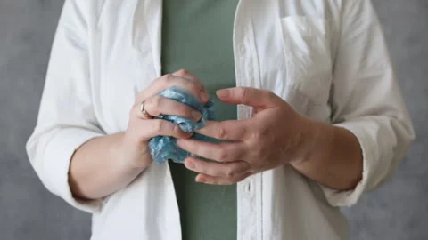 Close up of hand squeezes plastic bag. Stock Footage 302790925