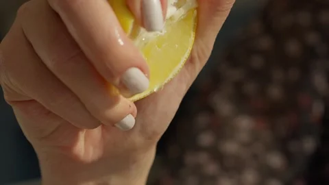 Close Up of Hand Squeezing Fresh Lemon Over Salad Stock Footage 336466889
