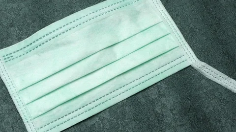 Close up hand sticks Virus note on surgical mask Stock Footage 127183689