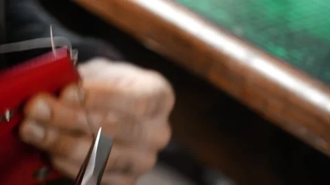 Close up hand stitching leather wallet edge Stock Footage 315529254