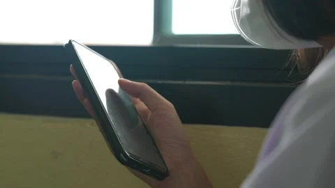 Close up hand of student holding mobile phone use learning in classroom 動画素材 221611299