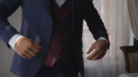 Close up hand stylish man in a suit fastening buttons on his jacket. Stock Footage 116021748