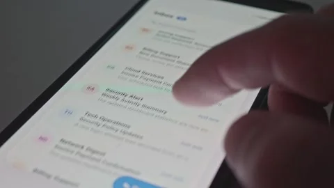 Close Up of Hand Swiping Endless Unread Messages on Phone Display Stock Footage 341569772