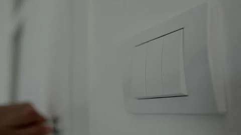 Close up hand switch on electric light indoor. Vídeo Stock 244349596