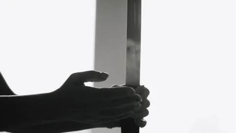 Close-up of a hand with a sword perform exercises on a light background. Media 스톡 동영상 160648838