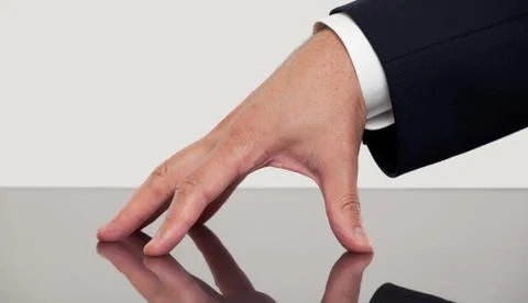 Close up of a hand on a table Stock Photos