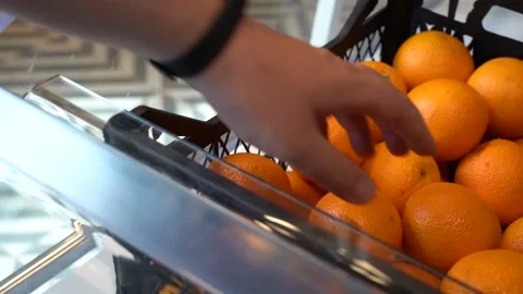 Close-up hand takes an orange Video stock 152687629