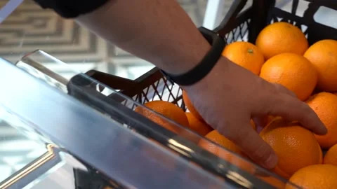 Close-up Hand takes an orange Stock Footage 153909683
