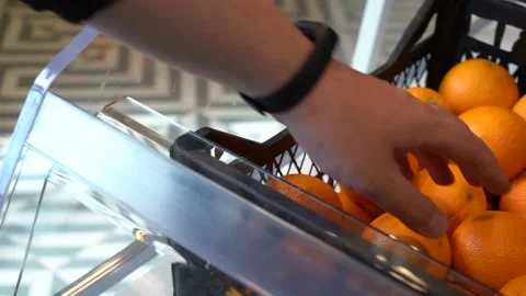 Close-up hand takes an orange Video stock 156485175