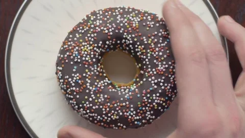 Close-up of hand taking a delicious doughnut from the plane Video stock 74493583