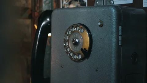 Close up of hand taking handset and dial the number in the phonebooth Stock Footage 127598573