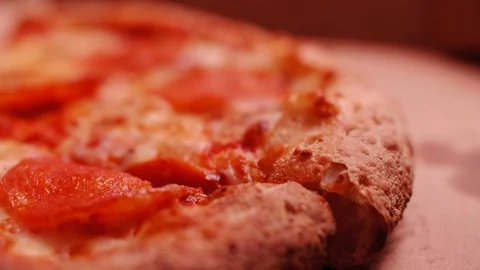 Close-up of hand taking a pepperoni pizza slice from the delivery box Video stock 123660411
