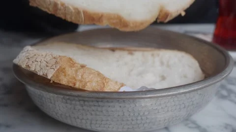 Close Up of Hand Taking a Slice of Fresh Bread from a Bowl 스톡 동영상 330663799