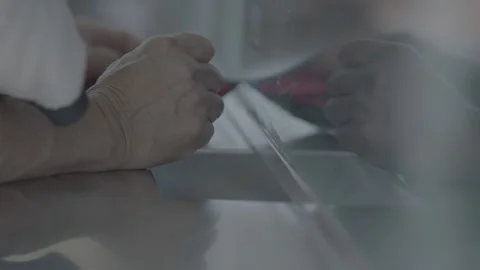Close Up Hand Taking Ticket At Box Office Window Stock Footage 134734235