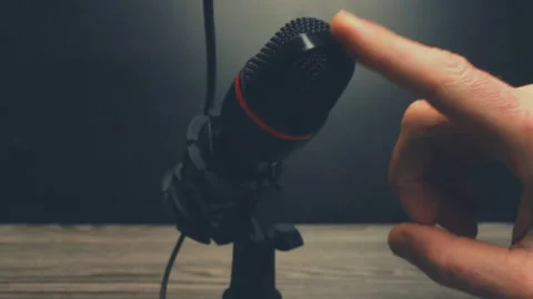 Close Up Hand Tapping Microphone Grille For Sound Check In Studio Stock Footage 330622791