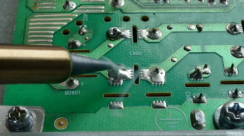 Close up of hand of technical Electronics Soldering a computer circuit board Video stock 69060636