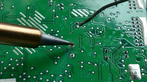 Close up of hand of technical Electronics Soldering a computer circuit board Video stock 69061050