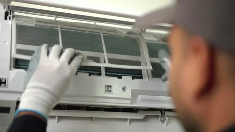 Close-up hand of Technician in uniform check and cleaning filters. Stock Footage 234256259