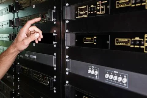 Close up of the hand of a technician working on a server in a large computer 스톡 사진