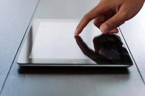Close hand touching on digital tablet Stock Photos